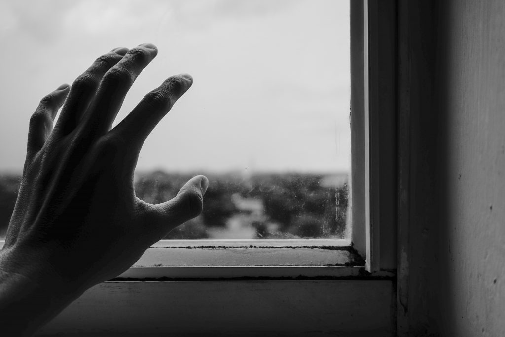 close up photography of hand near window 1264438 scaled